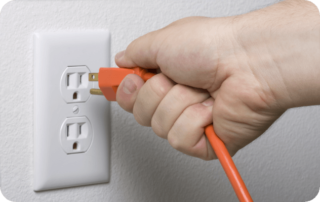 Man plugging in a cord